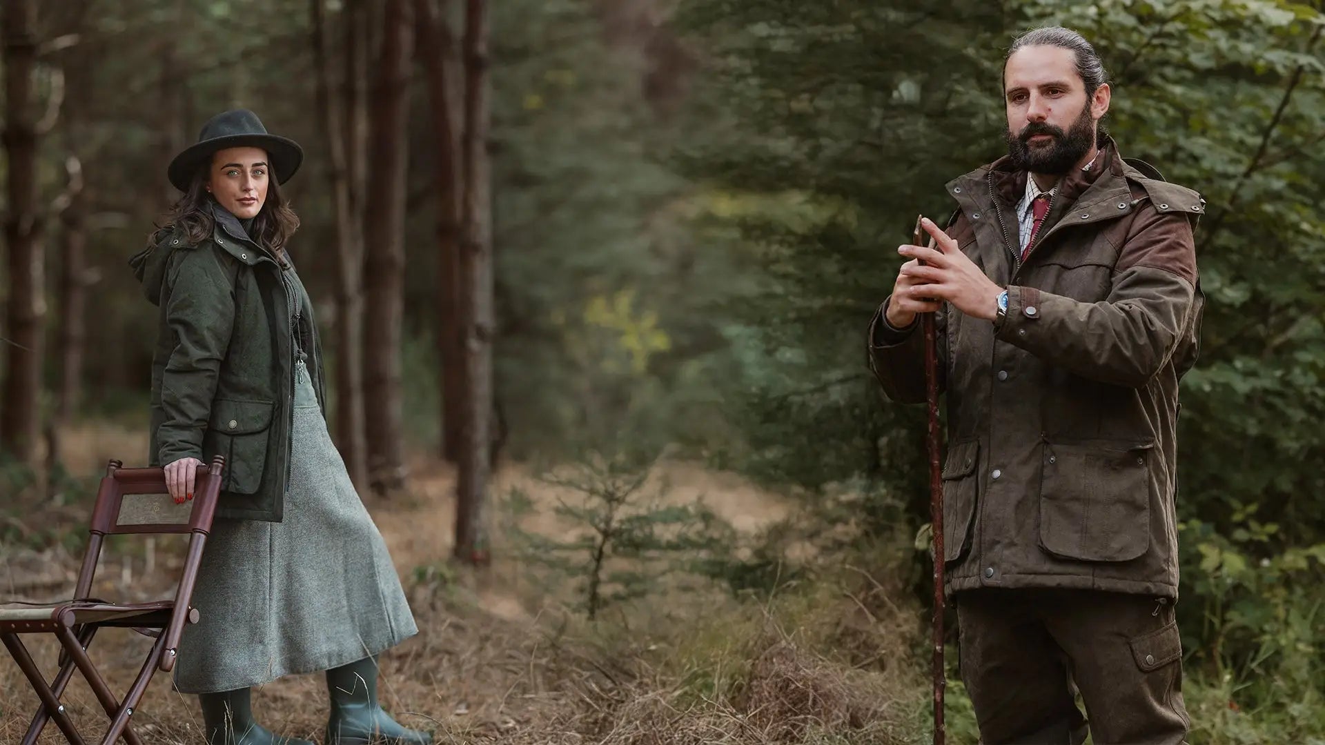 Man in Robyn performance field coat with walking stick