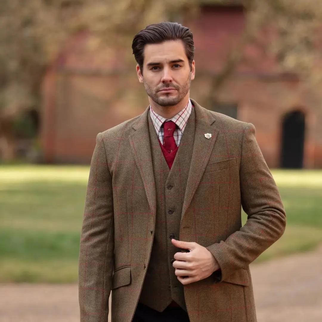 Man in brown tweed three-piece suit with red tie wearing Alan Paine Combrook mens tweed blazer