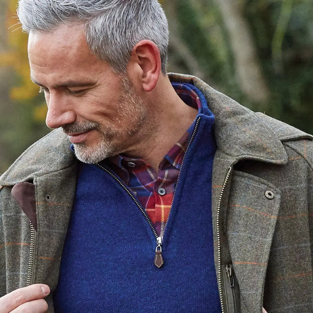 Middle-aged man in layered autumn outfit showcasing Alan Paine’s country clothing style