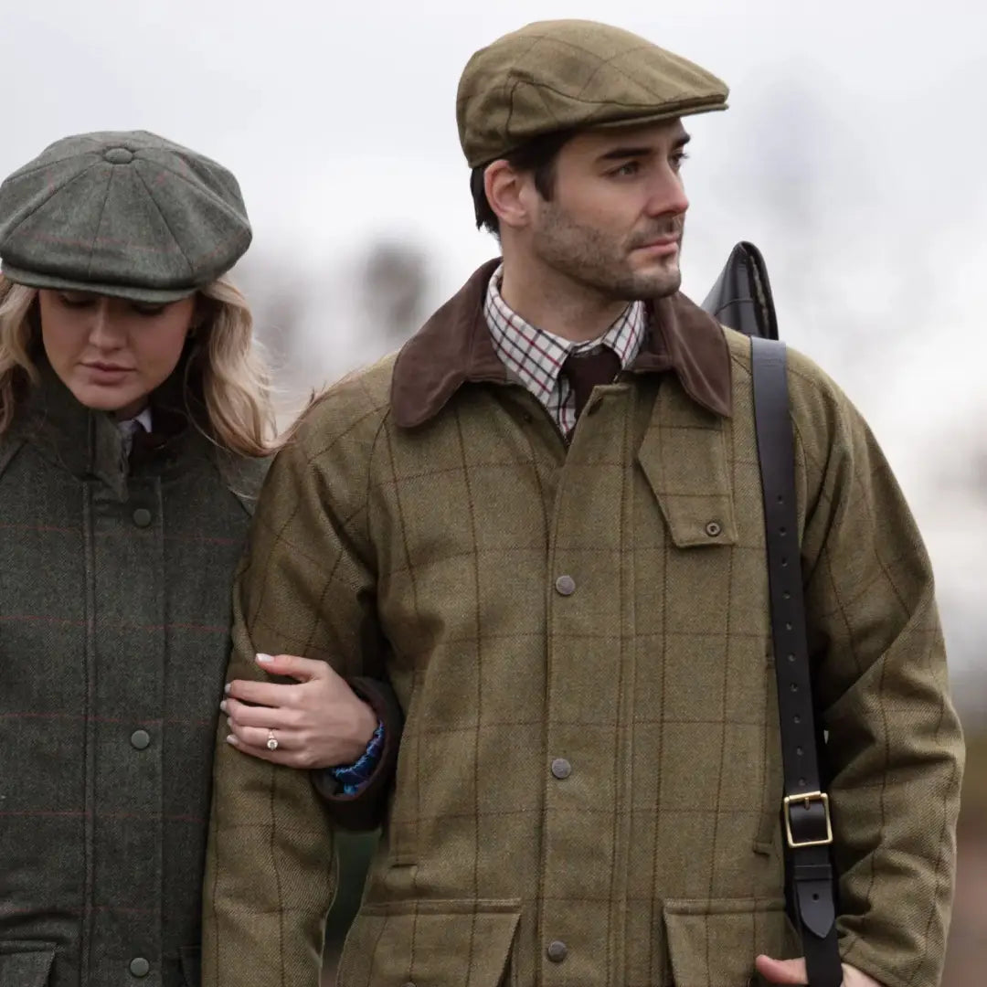 Alan Paine country wear collection two guys in durable wool blend tweed jackets and flat caps