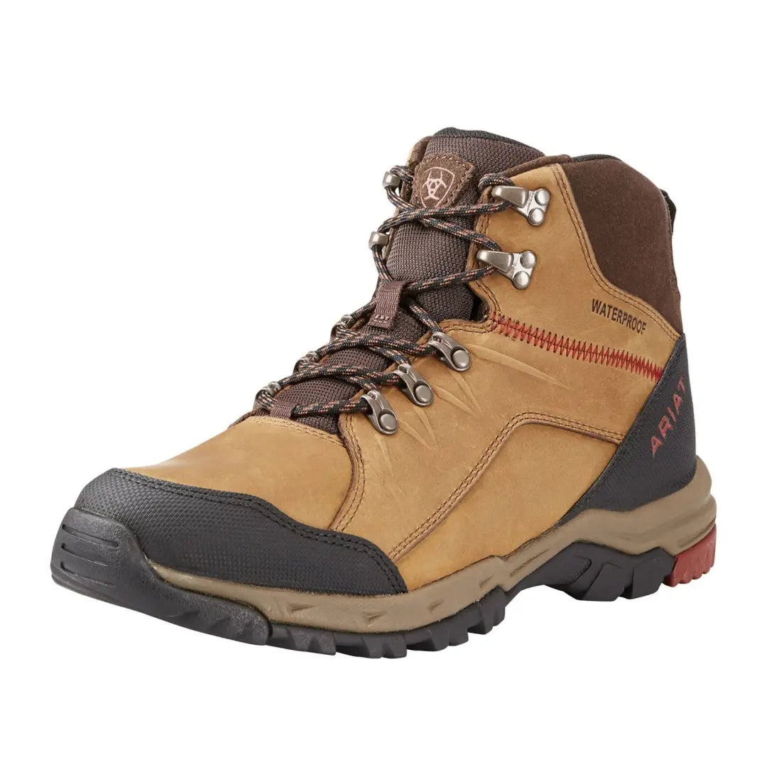 Rugged tan Ariat Skyline Mid Waterproof Boots with brown and red accents