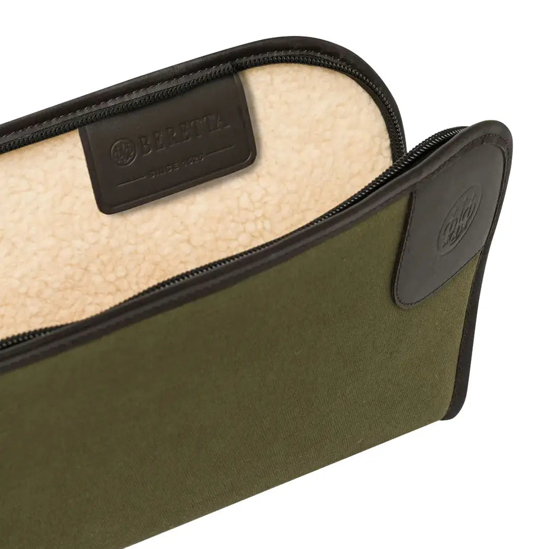 Open green Beretta Terrain EVO Canvas Gun Case with brown leather accents for hunting
