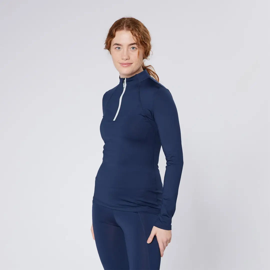 Woman in navy athletic wear from Cameo Core Collection for country clothing and hunting