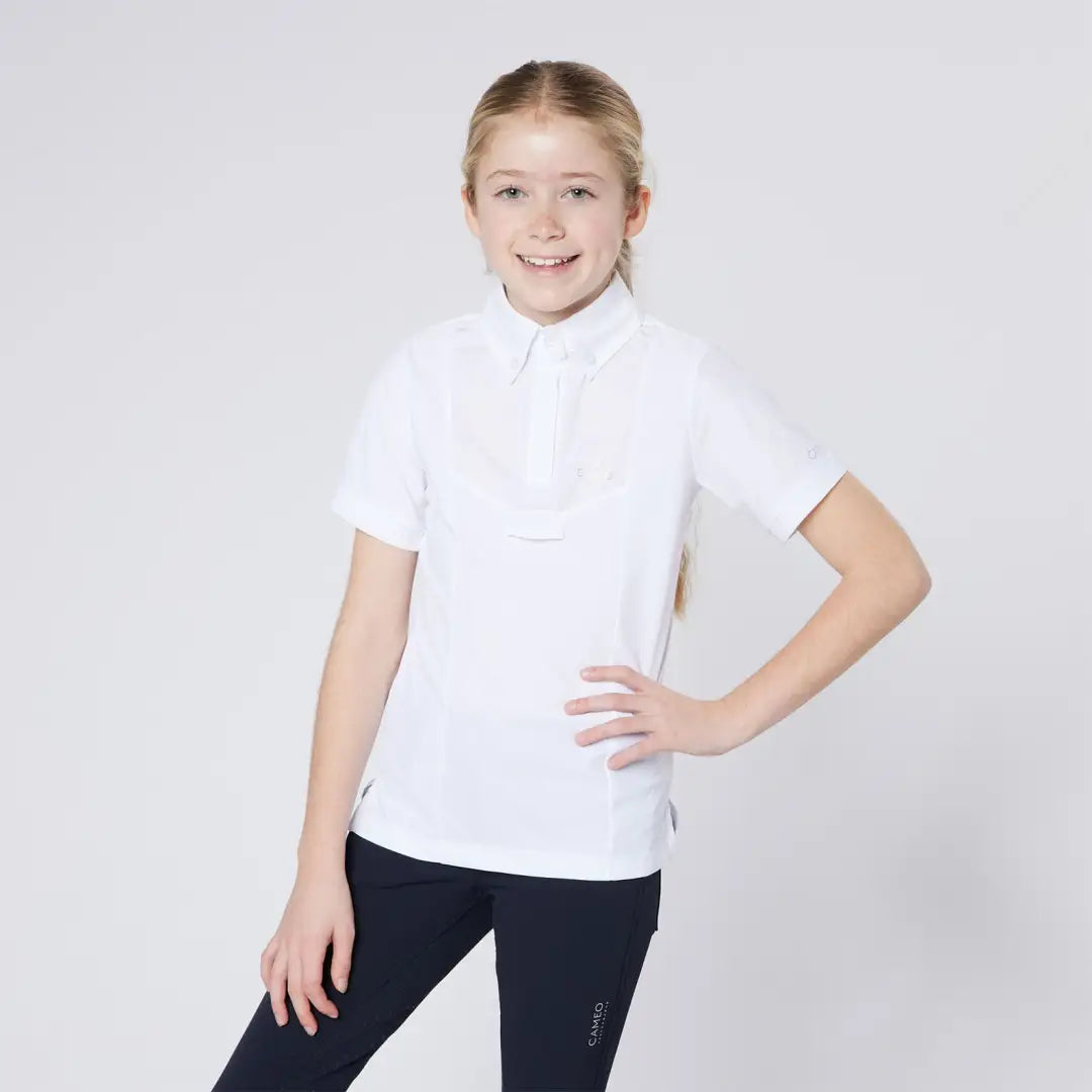 Girl in white polo shirt and dark leggings, perfect for country clothing outdoors