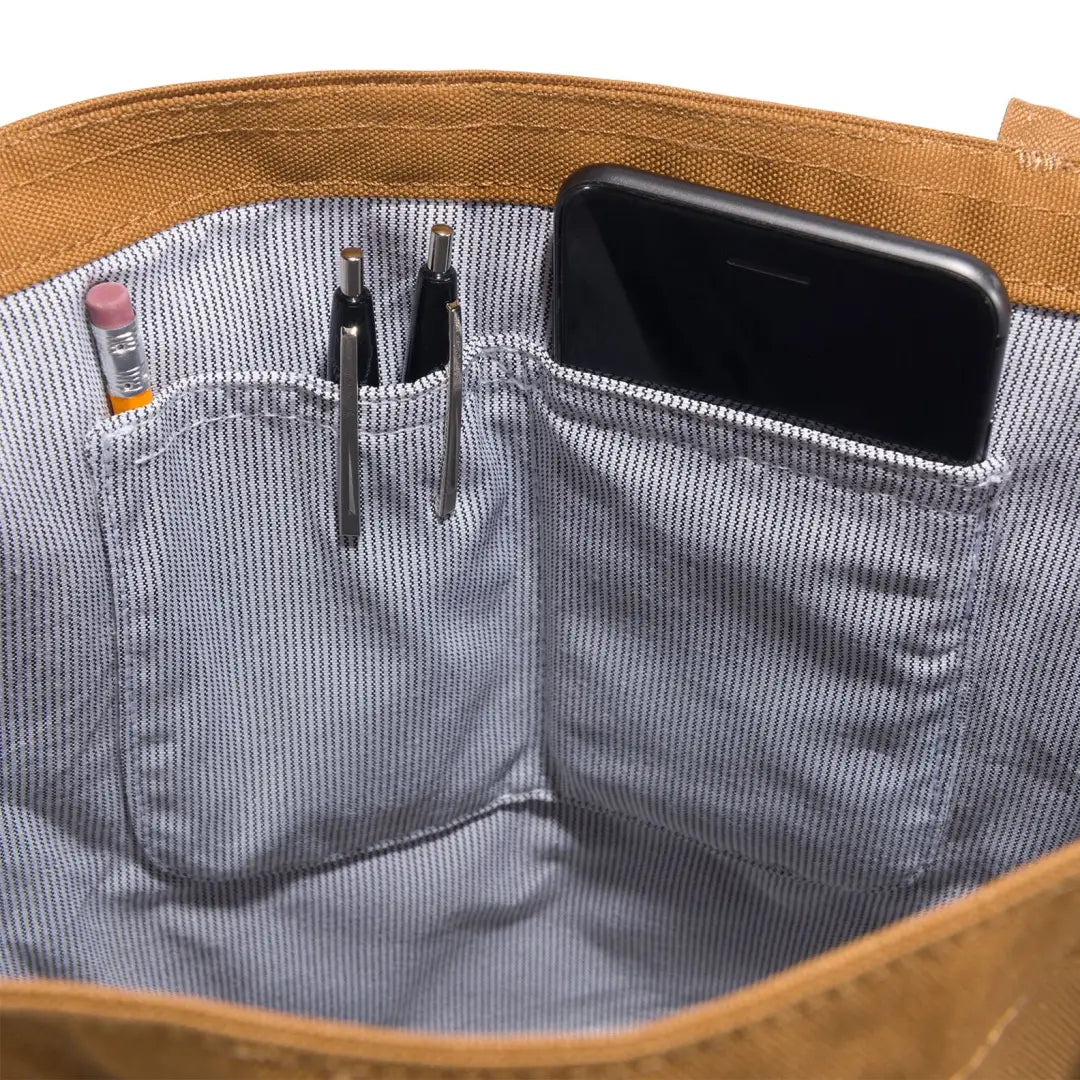 Carhartt vertical open tote bag in brown canvas with pockets and phone holder