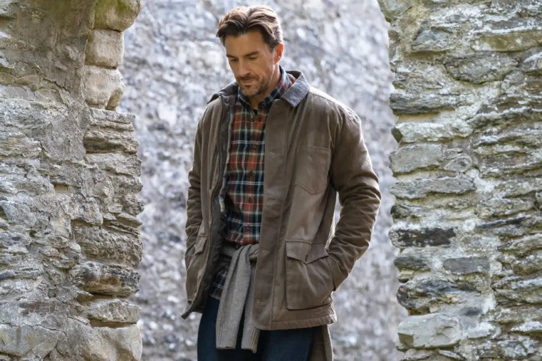 Olive green Hoggs of Fife Balerno waxed canvas barn coat with plaid shirt and scarf