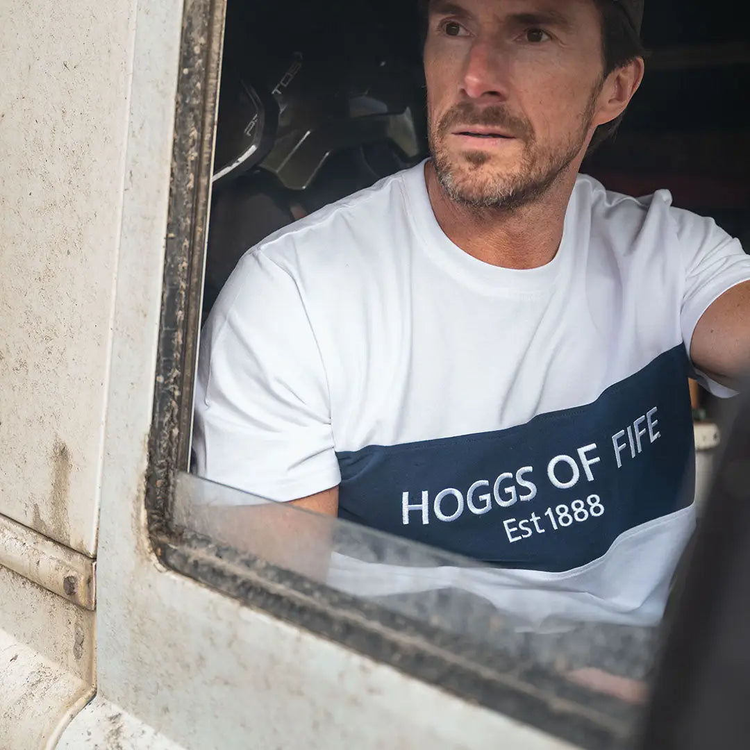 Man in a Fife Dalbeattie Colour Block T-Shirt featuring white and navy colors
