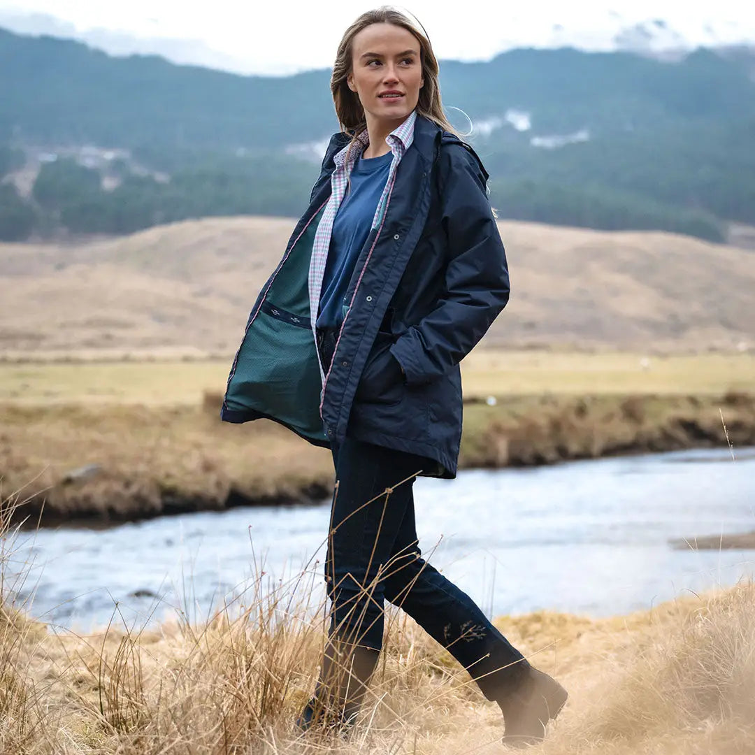 Woman in Hoggs of Fife Fara Waterproof Jacket, stylish navy blue waterproof jacket