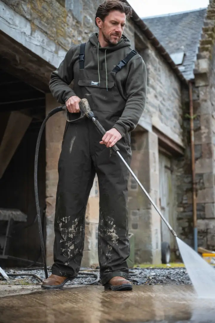 Black waterproof jumpsuit with hood and suspenders from Hoggs of Fife Green King II waterproof collection