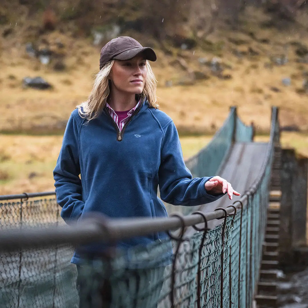 Woman in blue fleece jacket wearing Hoggs of Fife zip fleece, perfect for country clothing