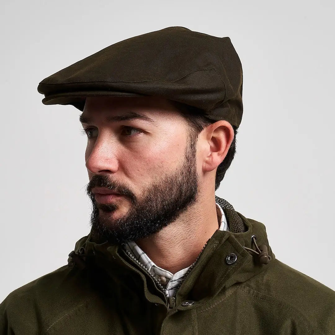 Dark olive Jack Pyke wax flat cap with structured wrinkled finish