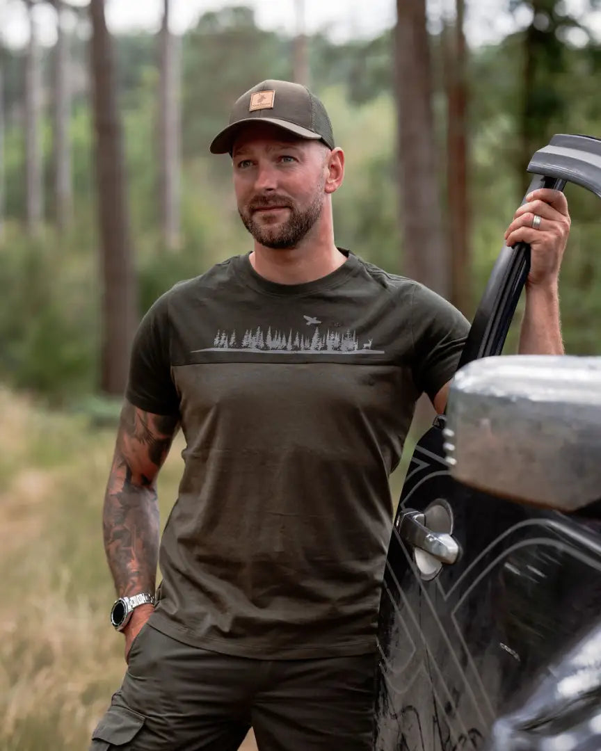Man in olive green forest clothing graphic T-shirt, perfect outdoor graphic tee