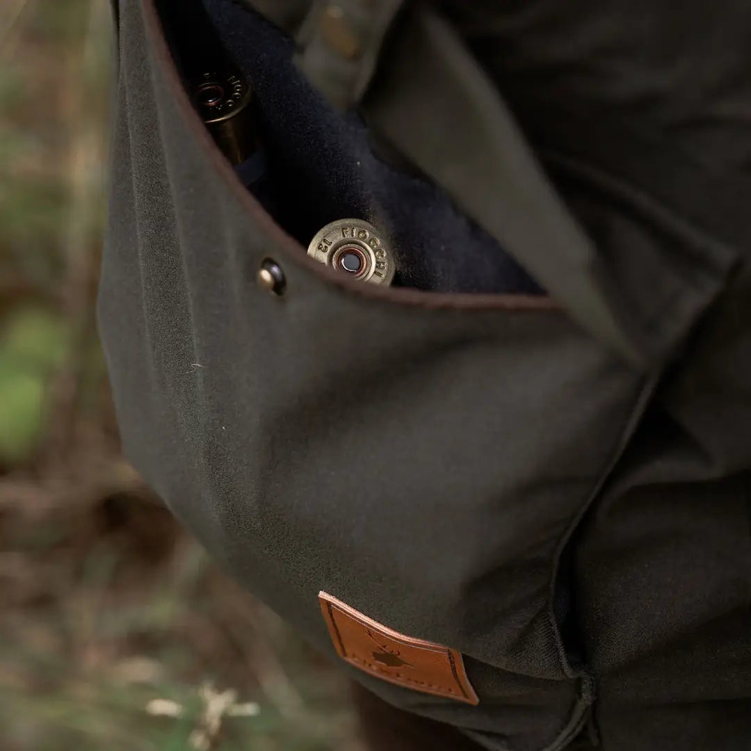 Olive green forest ladies marsh jacket with ammo in pocket for outdoor adventures