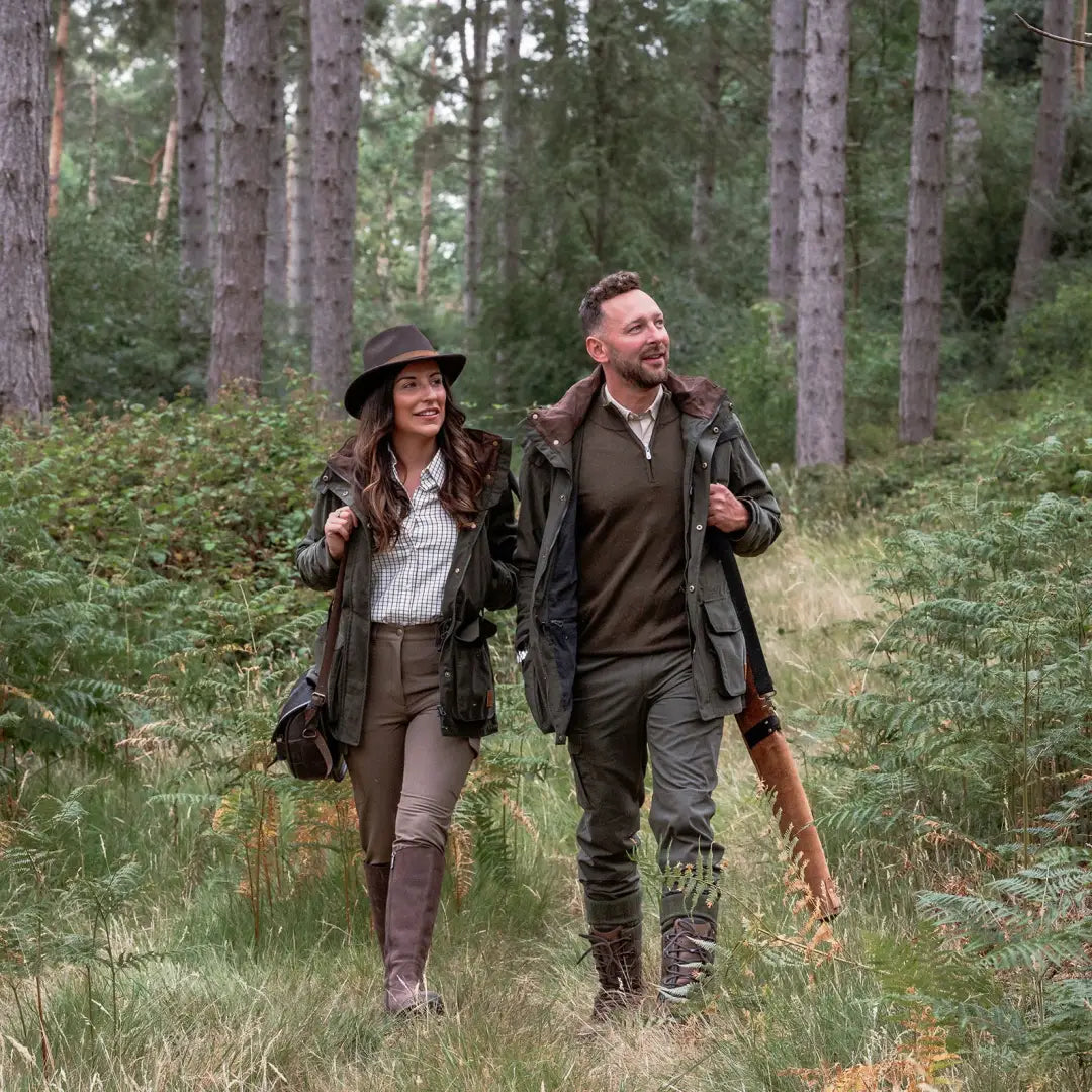 Couple in hunting attire wearing the New Forest Ladies Marsh Jacket outdoors