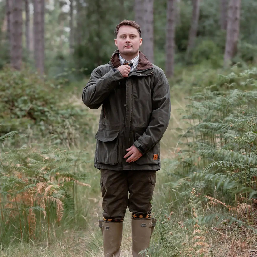 Man in olive green forest marsh jacket, perfect for hunting or outdoor adventures