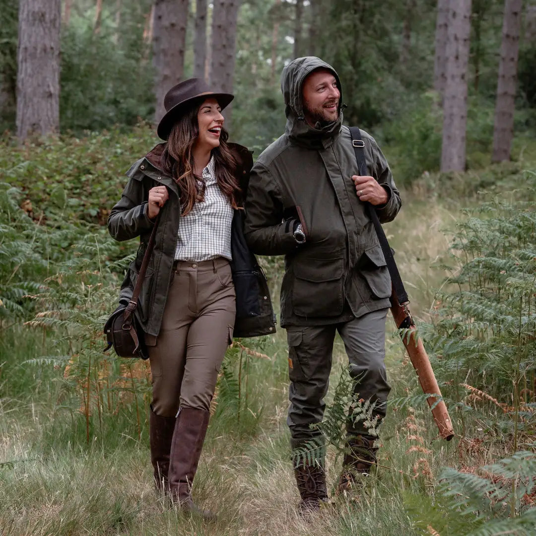 Two people in hunting attire showcasing the New Forest Marsh Jacket in forest marsh style
