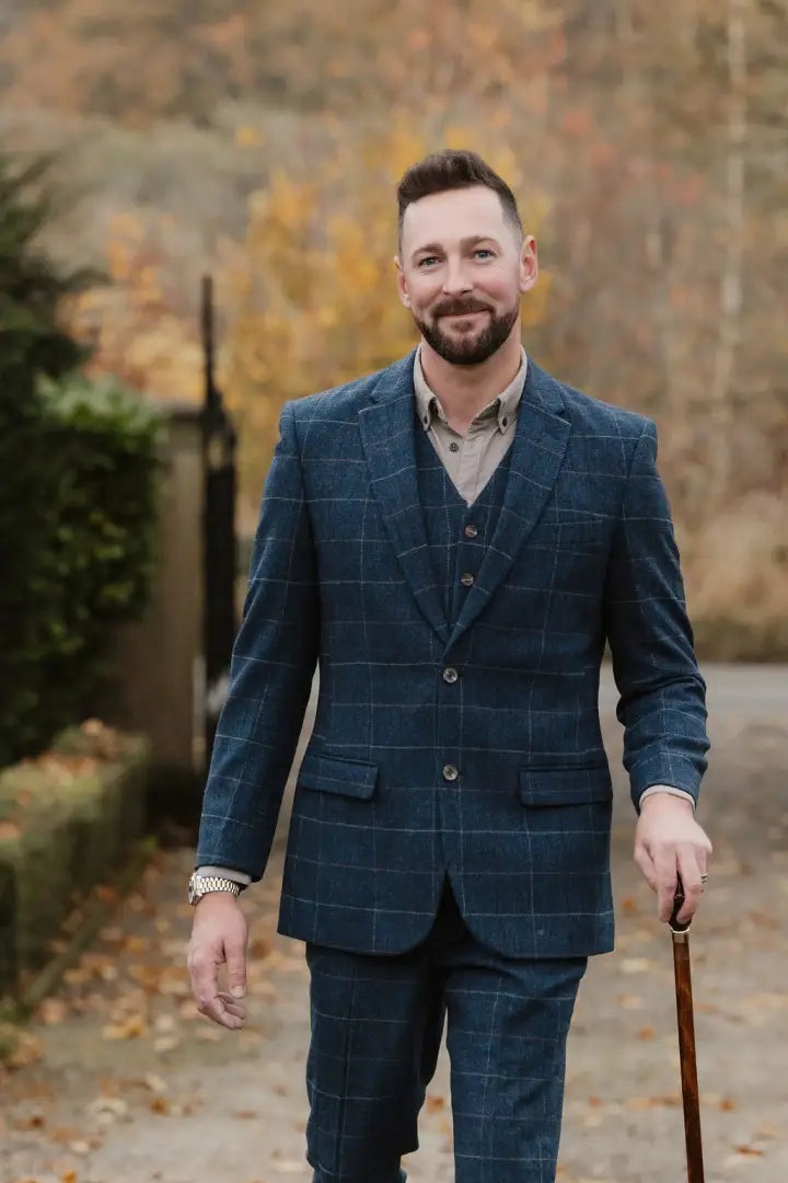 Man in a blue plaid suit showcasing the New Forest wool tweed blazer
