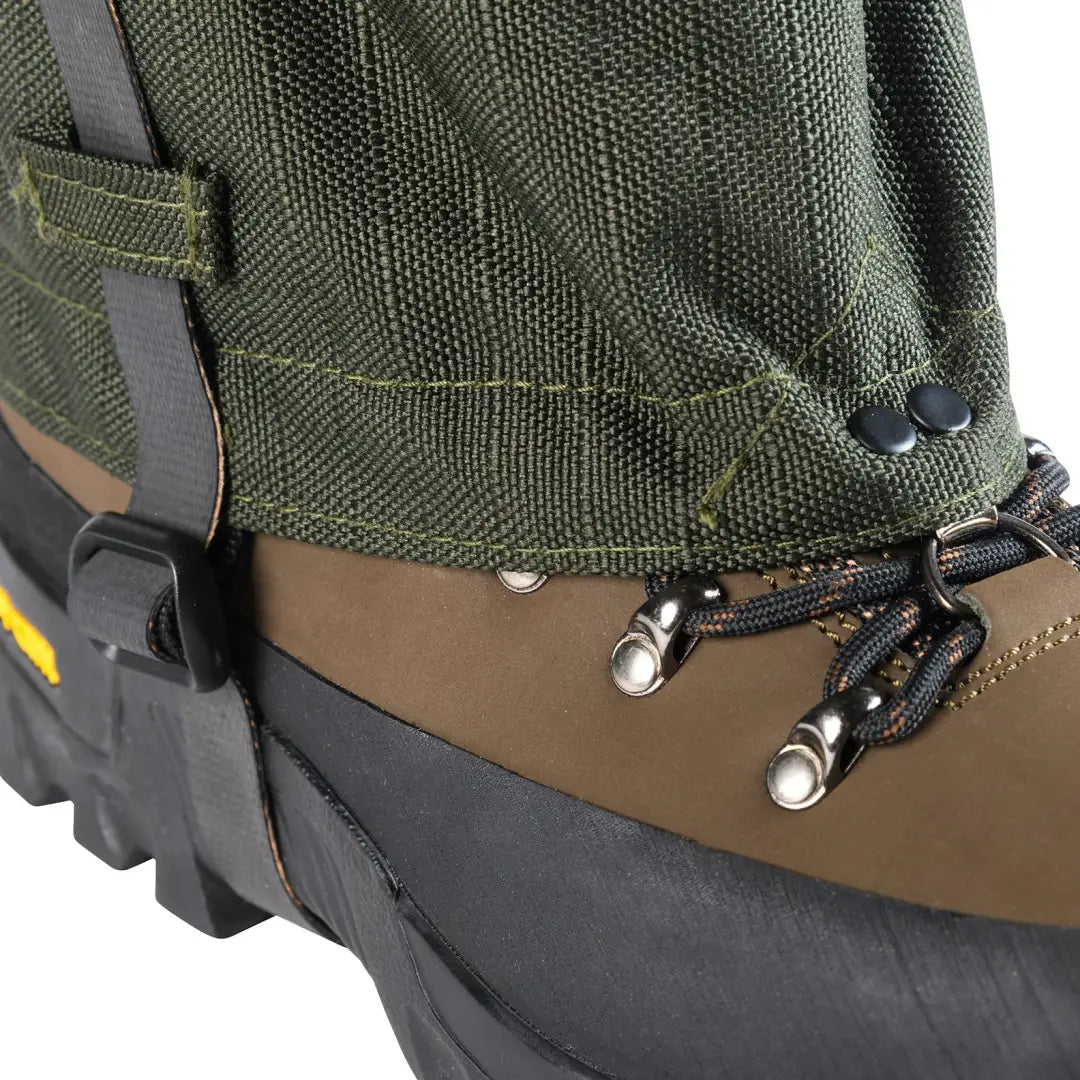 Green gaiter on a hiking boot for outdoor adventures in country clothing and hunting