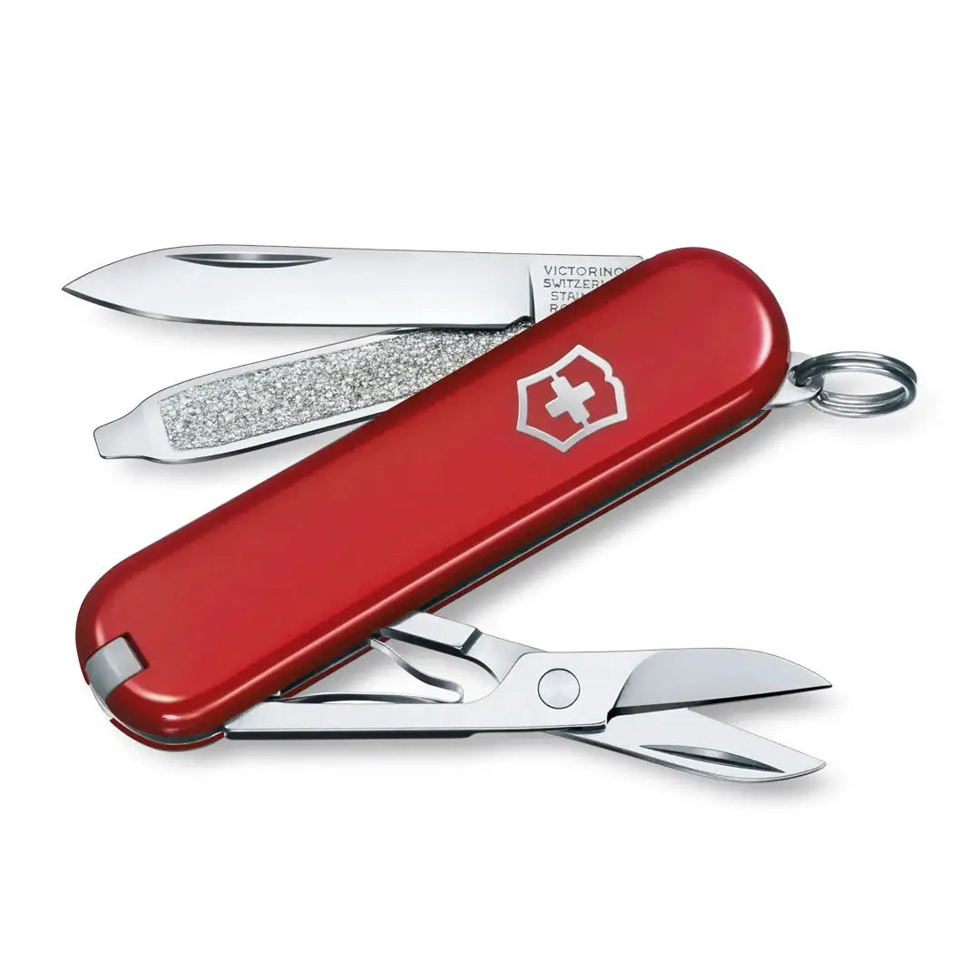 Red Swiss Army knife with tools, perfect for country clothing and hunting adventures