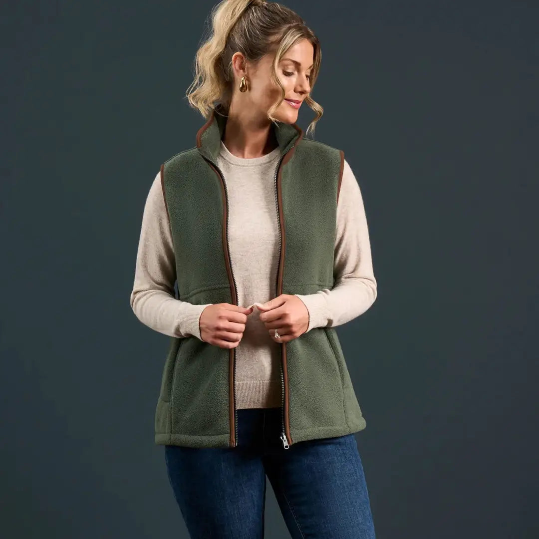 Woman wearing Alan Paine Aylsham Ladies Fleece Gilet for warmer days worn as extra layer underneath