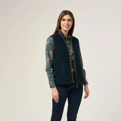 Woman wearing Alan Paine Aylsham Ladies Fleece Gilet over floral shirt for warmer days worn