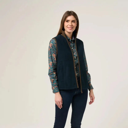 Woman wearing Alan Paine Aylsham Ladies Fleece Gilet over floral shirt for warmer days worn