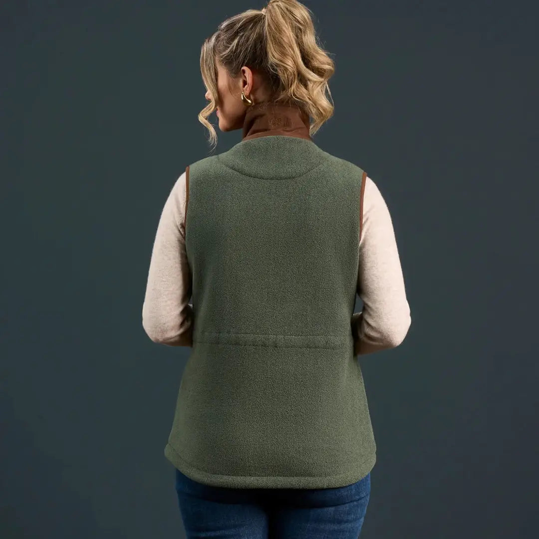 Woman wearing Alan Paine Aylsham Ladies Fleece Gilet in olive green for warmer days worn