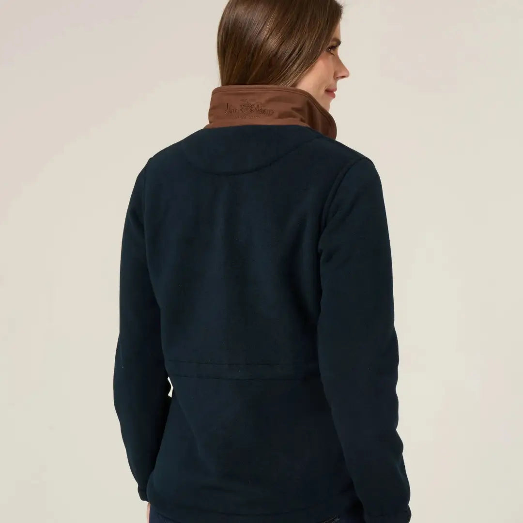Woman wearing Alan Paine Aylsham versatile fleece jacket with navy blue and brown collar