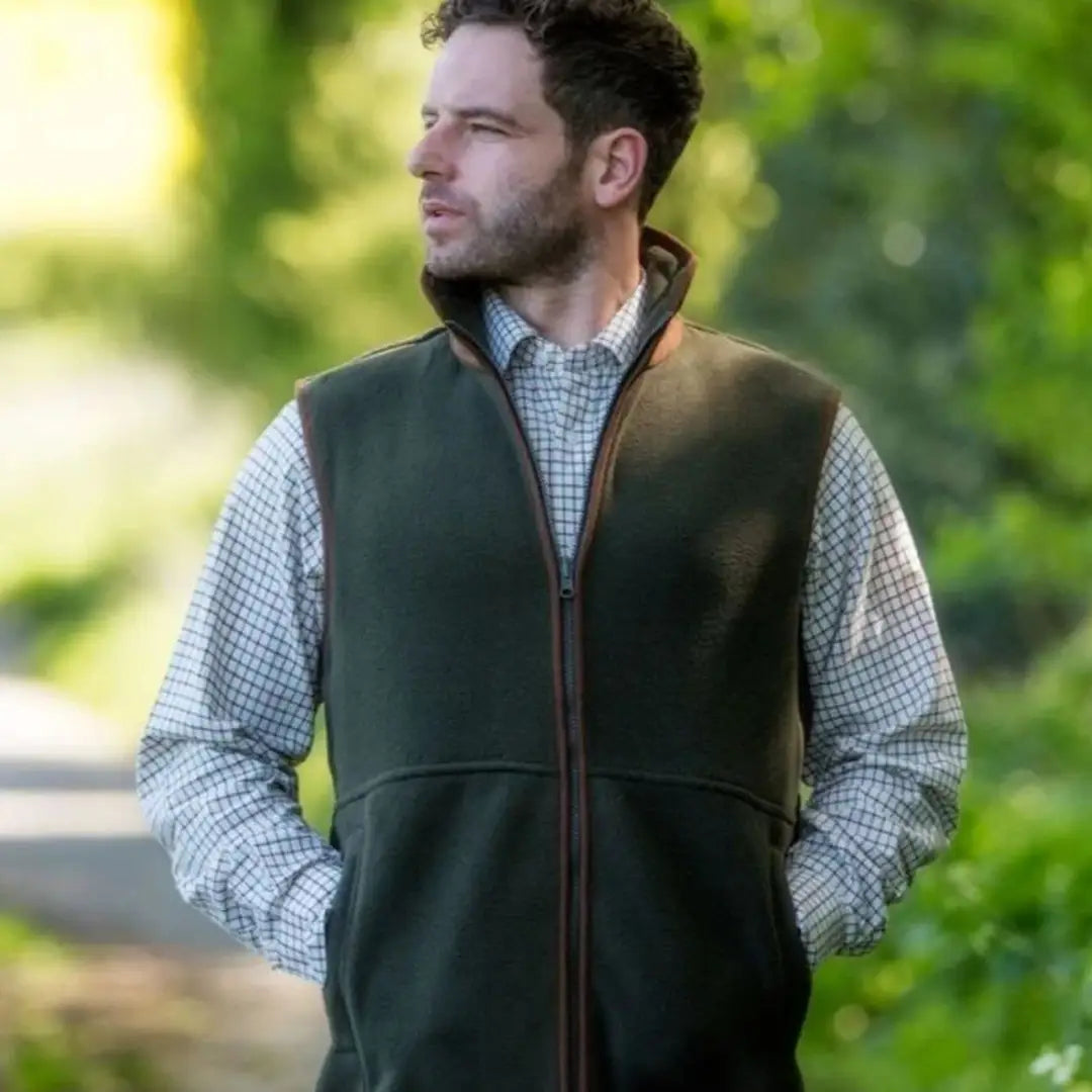 Alan Paine Aylsham men’s fleece gilet with a man in a checkered shirt and green vest
