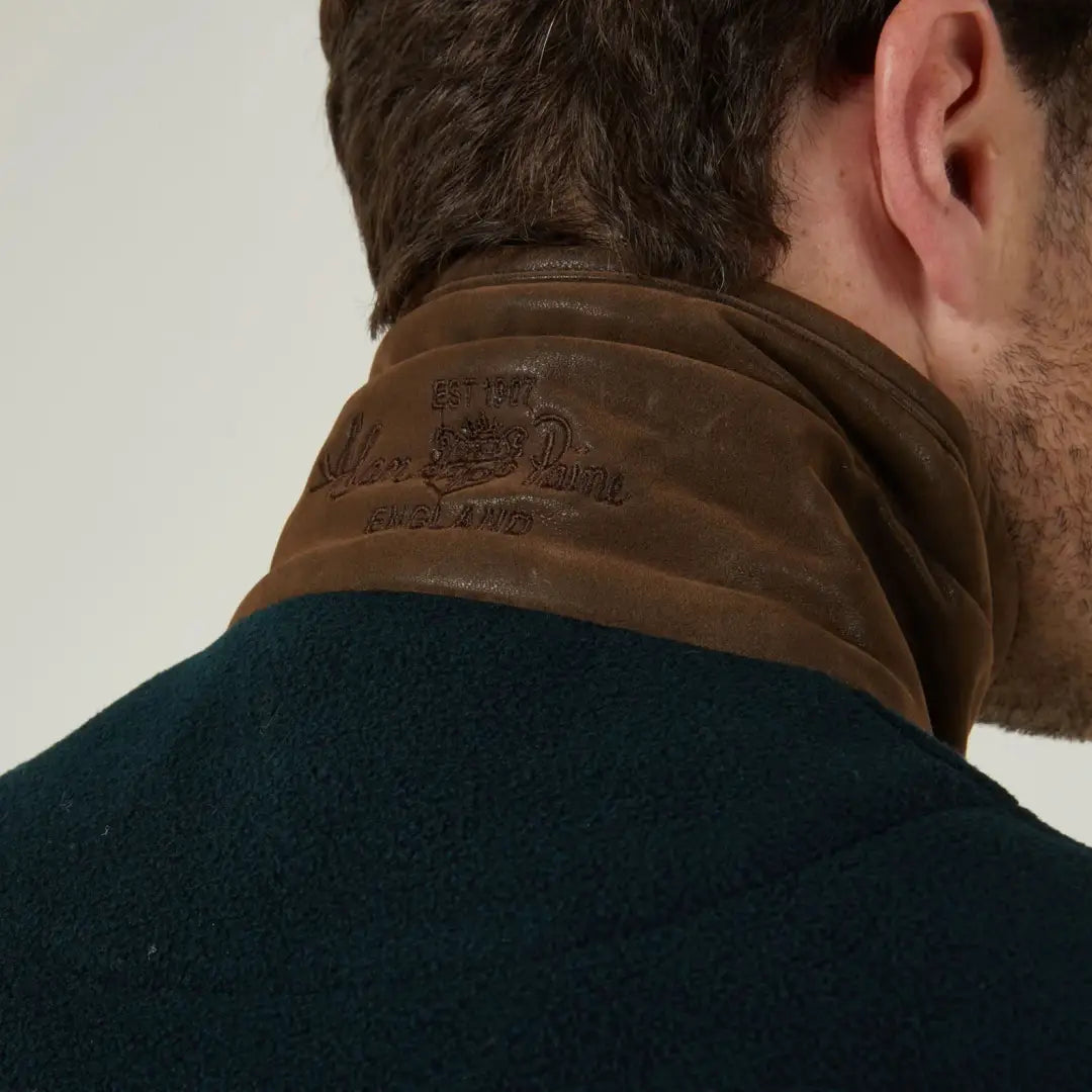 Dark green alan paine aylsham fleece jacket with brown leather collar, a versatile piece