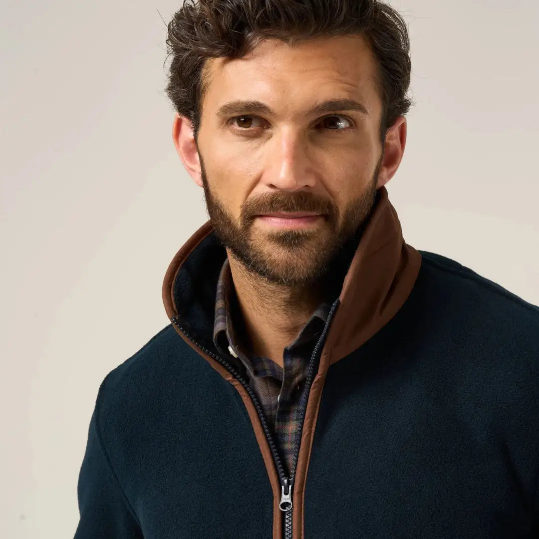 Man wearing Alan Paine Aylsham fleece jacket with plaid shirt, a versatile option