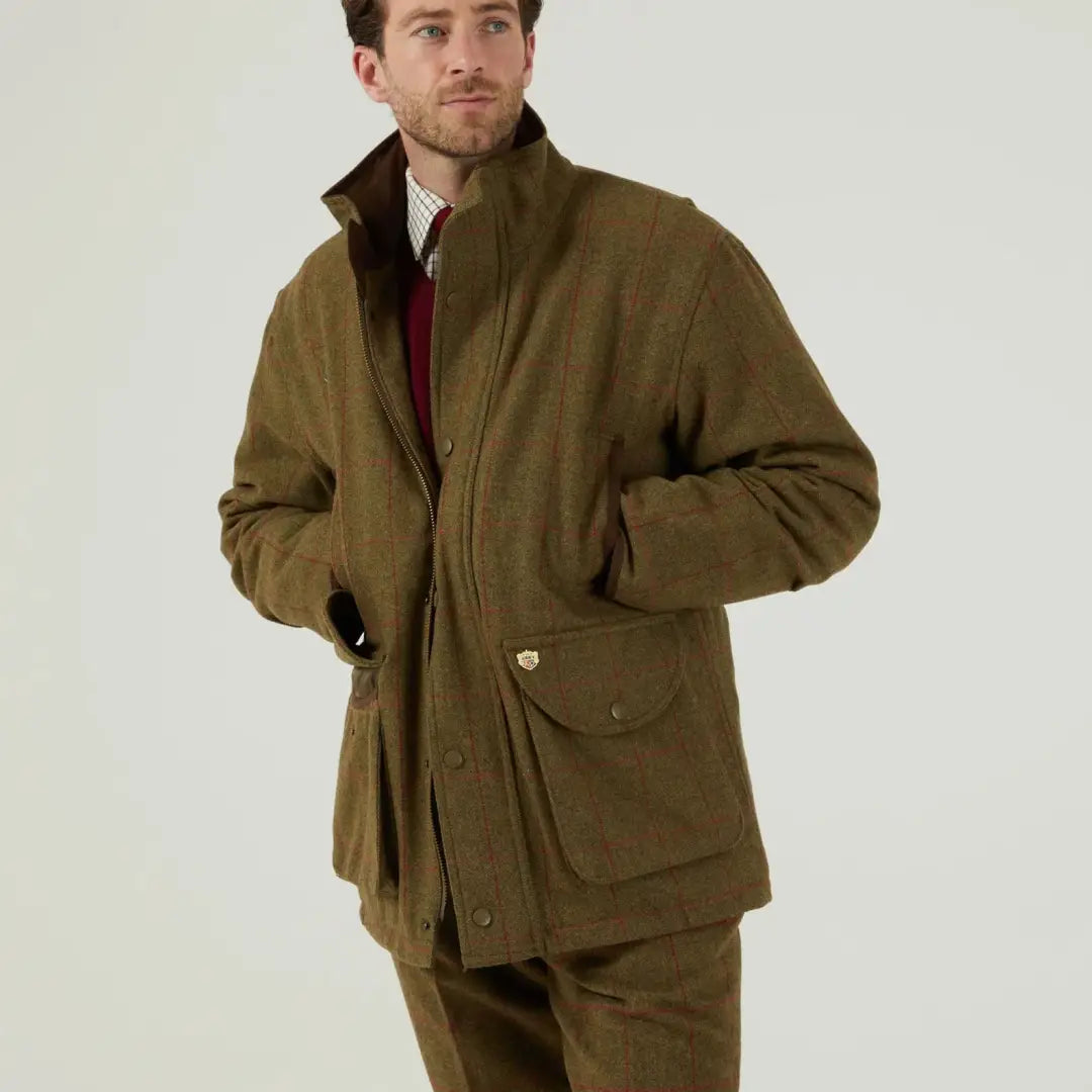 Men’s olive green tweed field coat and trousers by Alan Paine Combrook