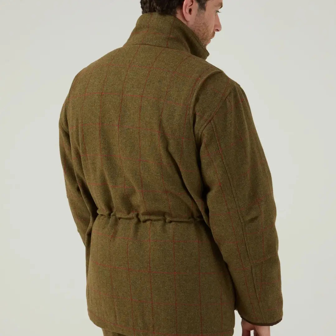 Men’s olive green tweed field coat with red plaid pattern and adjustable waist by Alan Paine Combrook