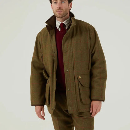 Men’s olive green tweed field coat from Alan Paine Combrook with a red sweater and plaid shirt