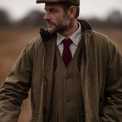 Middle-aged man in traditional British outfit showcasing Alan Paine Combrook Field Coat