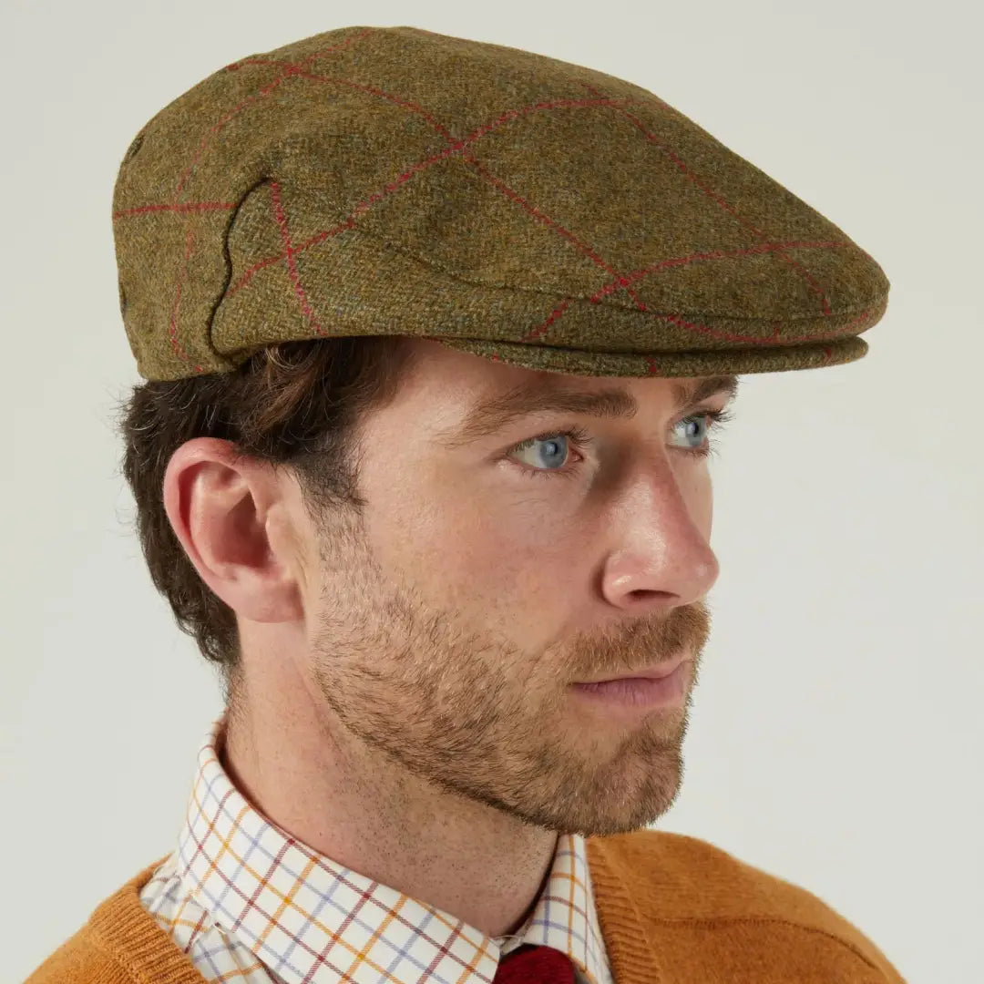 Alan Paine Combrook tweed flat cap with red plaid pattern for classic style