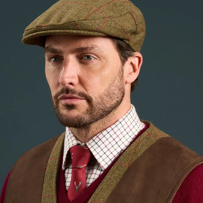 Man wearing Alan Paine Combrook water repellent pure wool tweed waistcoat and plaid shirt