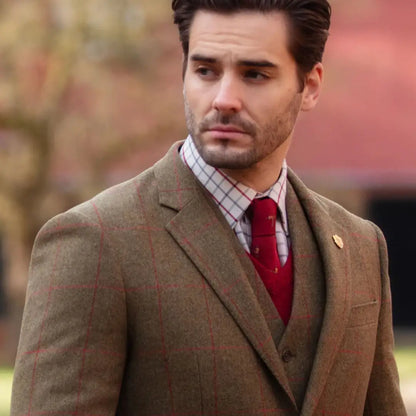 Man in Alan Paine Combrook mens tweed sports blazer with red tie and plaid shirt