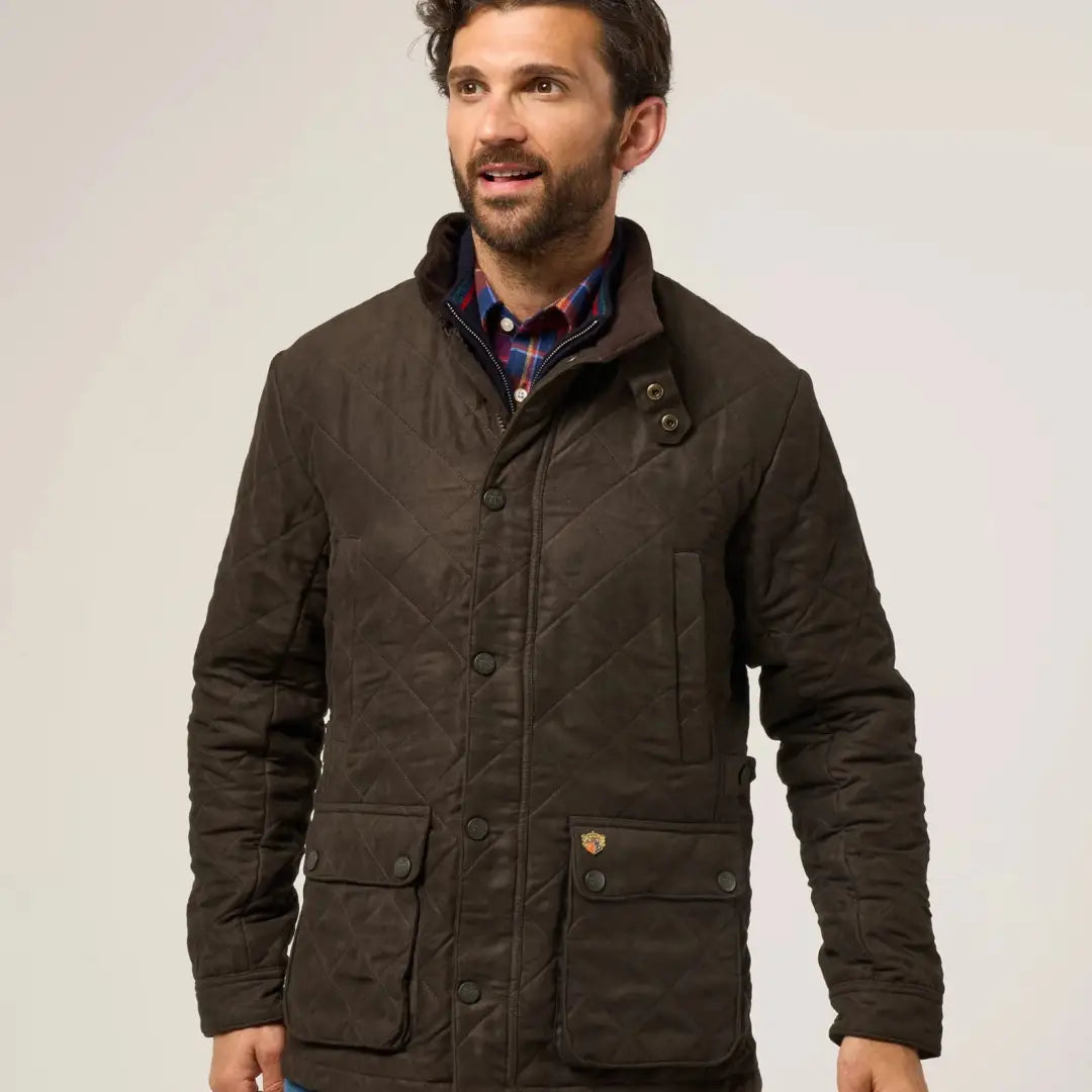 Men’s dark brown quilted jacket from Alan Paine Felwell collection with plaid shirt