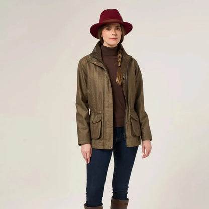 Luxurious Didsmere Ladies coat worn by woman in brown jacket dark jeans and red hat