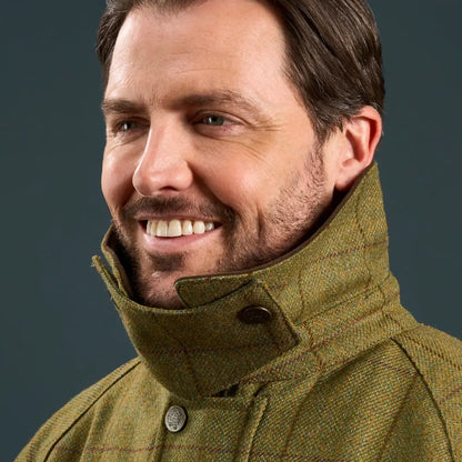 Man smiling in Alan Paine Country Wear Collection Rutland waterproof tweed coat