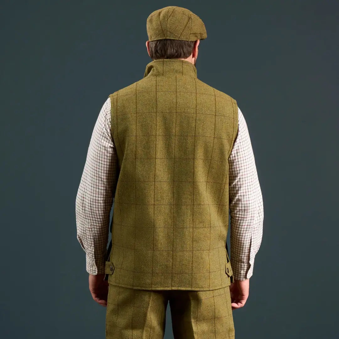Men’s green tweed waistcoat and flat cap from Alan Paine’s Rutland collection
