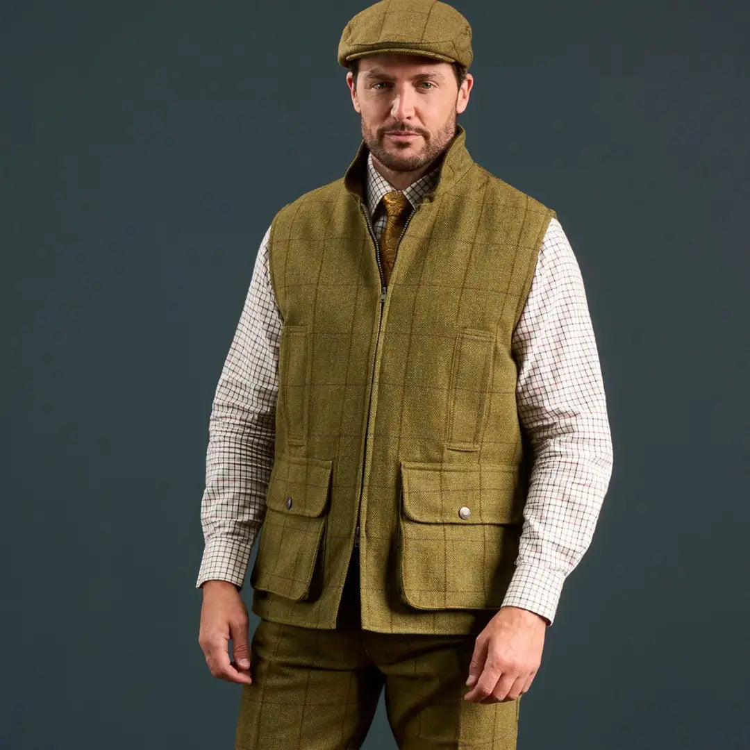 Men’s tweed waistcoat and flat cap from Alan Paine’s Rutland collection in olive green