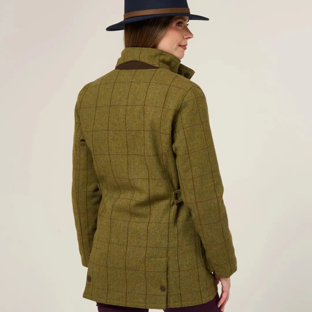 Woman wearing Alan Paine Rutland durable wool blend tweed waterproof coat with brown collar
