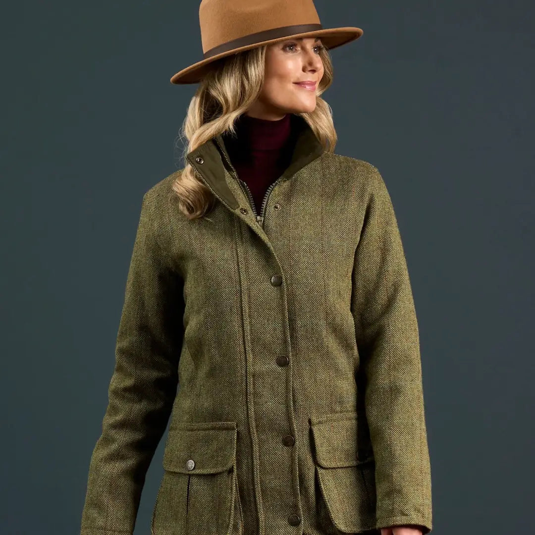 Women’s green tweed jacket with brown hat from Alan Paine Rutland collection