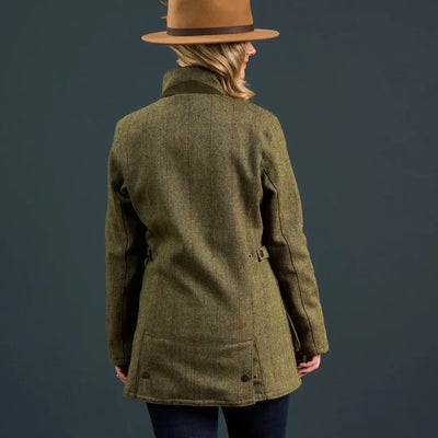 Woman in brown fedora and green tweed jacket wearing alan paine rutland coat