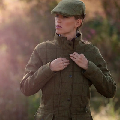 Woman in Alan Paine Rutland Ladies Tweed Waterproof Coat enjoying countryside vibes