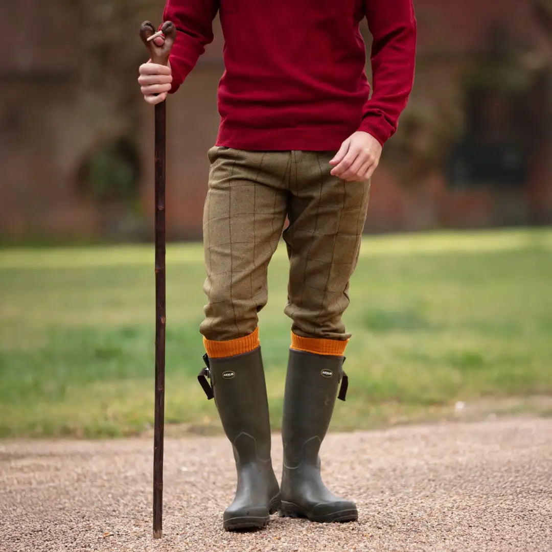 Person in red sweater plaid trousers and green wellington boots wearing Alan Paine Rutland Tweed Breeks