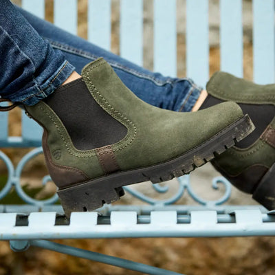 Olive green Chelsea boots with rugged soles, perfect for country clothing and hunting