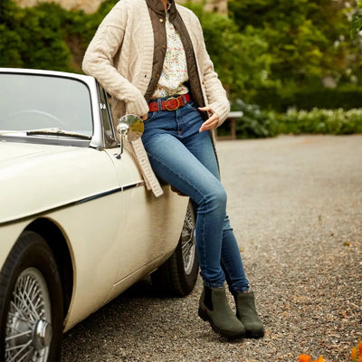 Classic white vintage car with a person in Ariat Wexford Lug boots, perfect for country outings